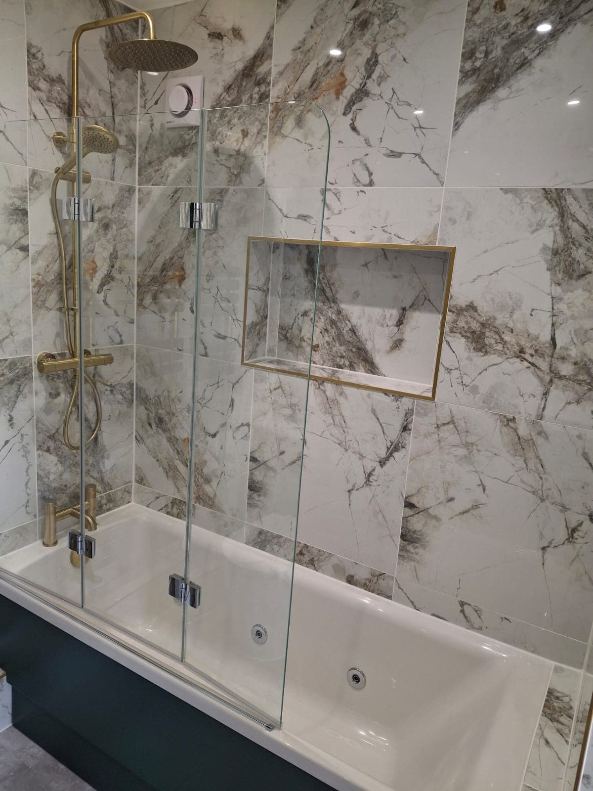 Freestanding bath with gold fittings installed by HOC Home Improvements in Caterham