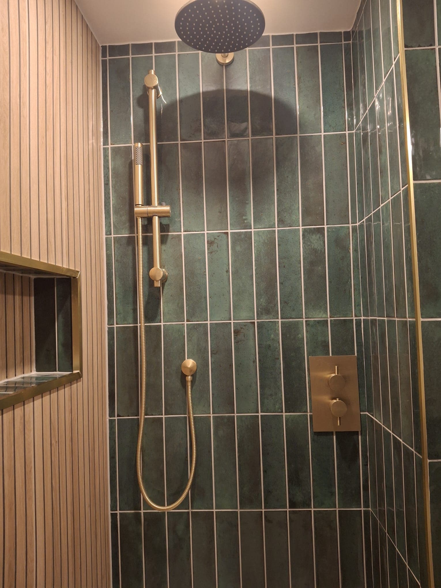 Green tiled shower enclosure fitted by HOC Home Improvements