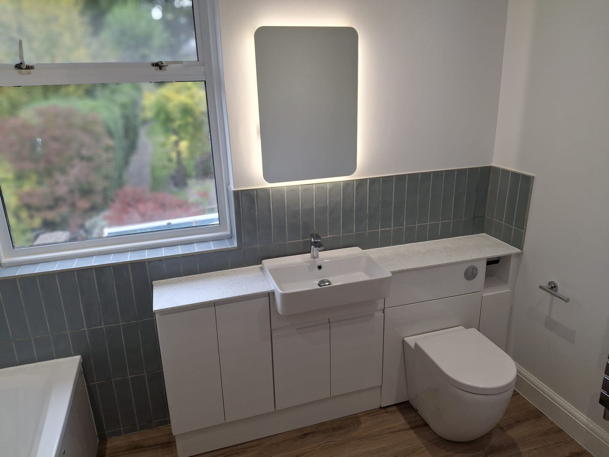 Clean white bathroom installation by HOC Home Improvements in Surrey